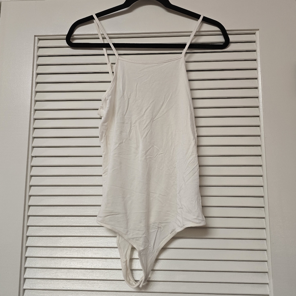 Little Black Bodysuit - White Sleeveless Bodysuit With Snap Enclosure